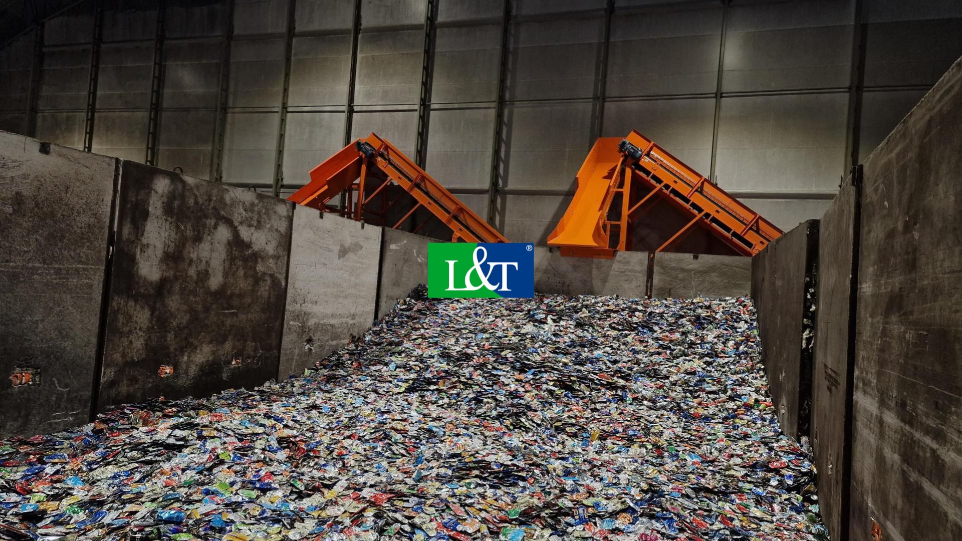 In this picture, you can see the end of the conveyor pushing the recycled beverage containers into a pile for further processing.